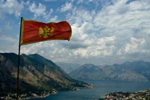 Flag of Montenegro over Kotor Bay